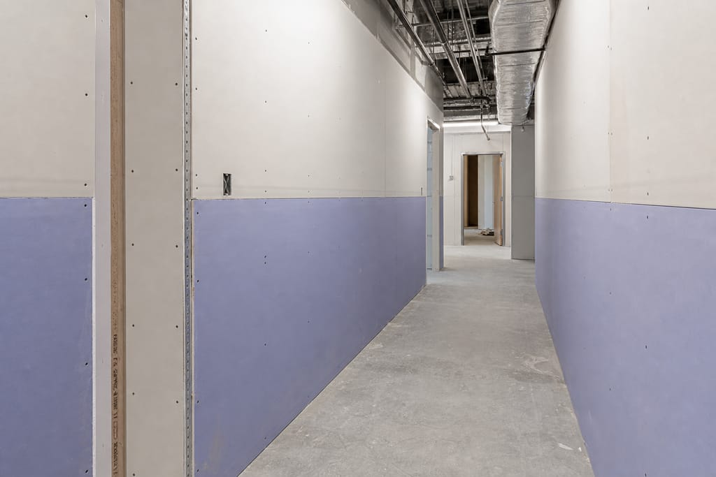 Impact-resistant backing for high-traffic corridors photo